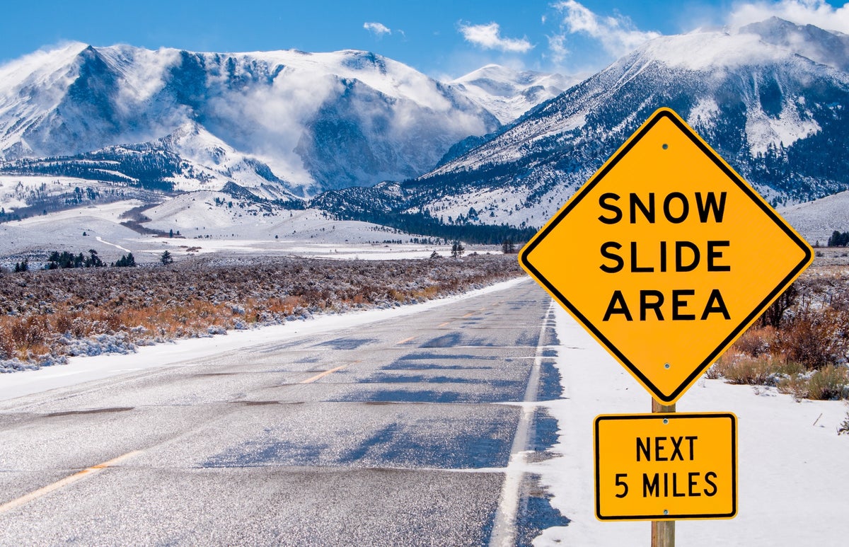 Motorists are warned of dangerous driving conditions on a road leading into the Sierra Nevada Mou...