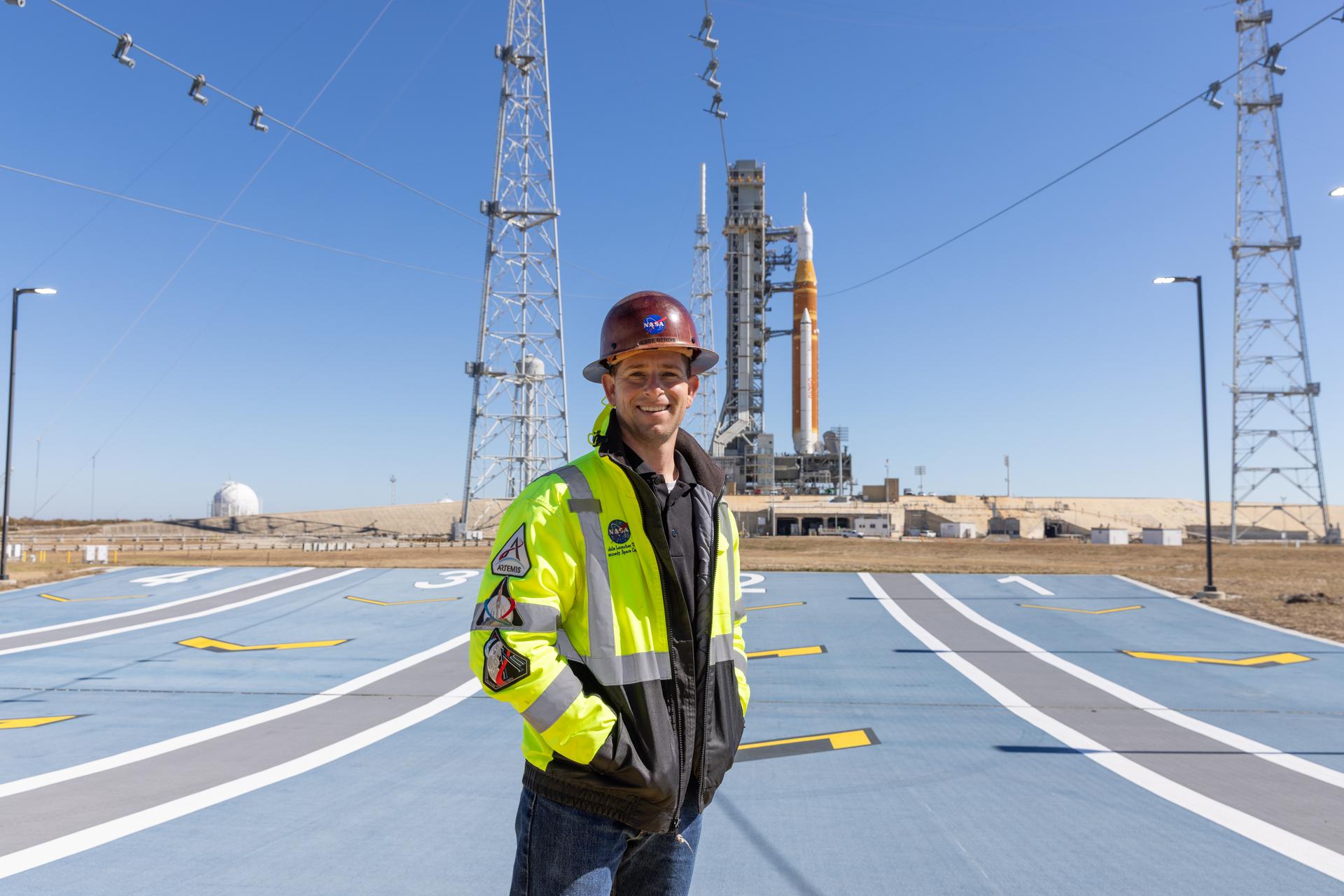 Image shows Jesse Berdis standing standing at the pad of Launch Complex 39B at NASA's Kennedy Spa...