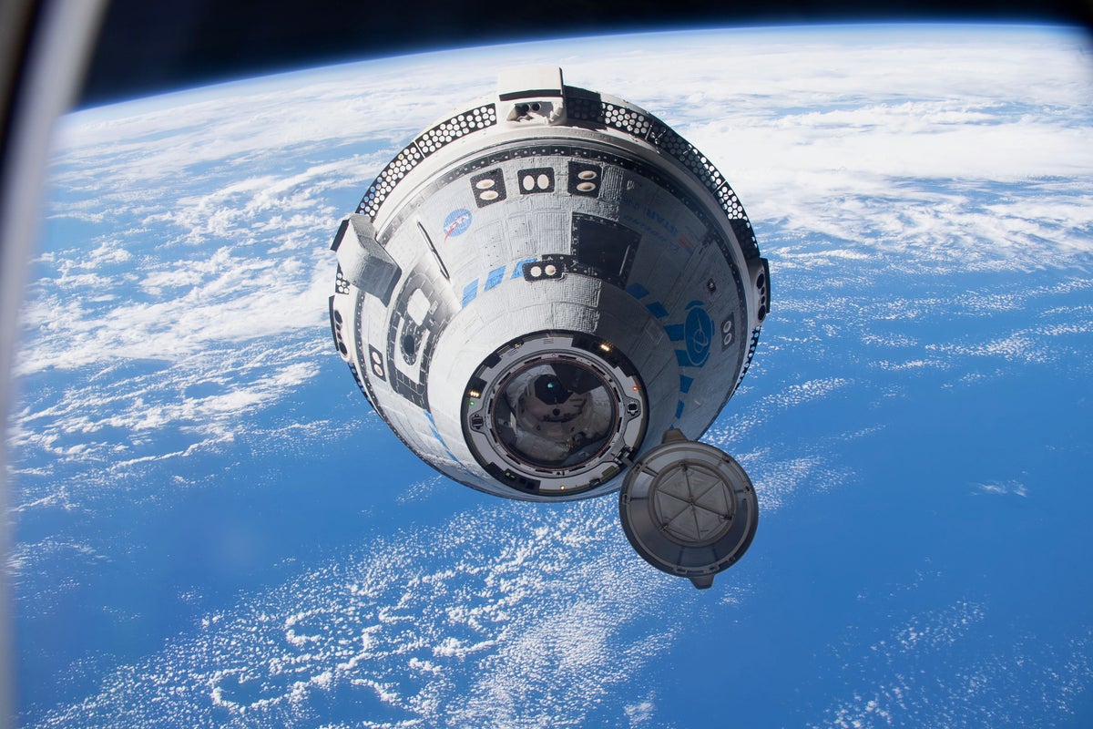 Boeing’s CST-100 Starliner ship approaches the International Space Station during the uncrewed ...