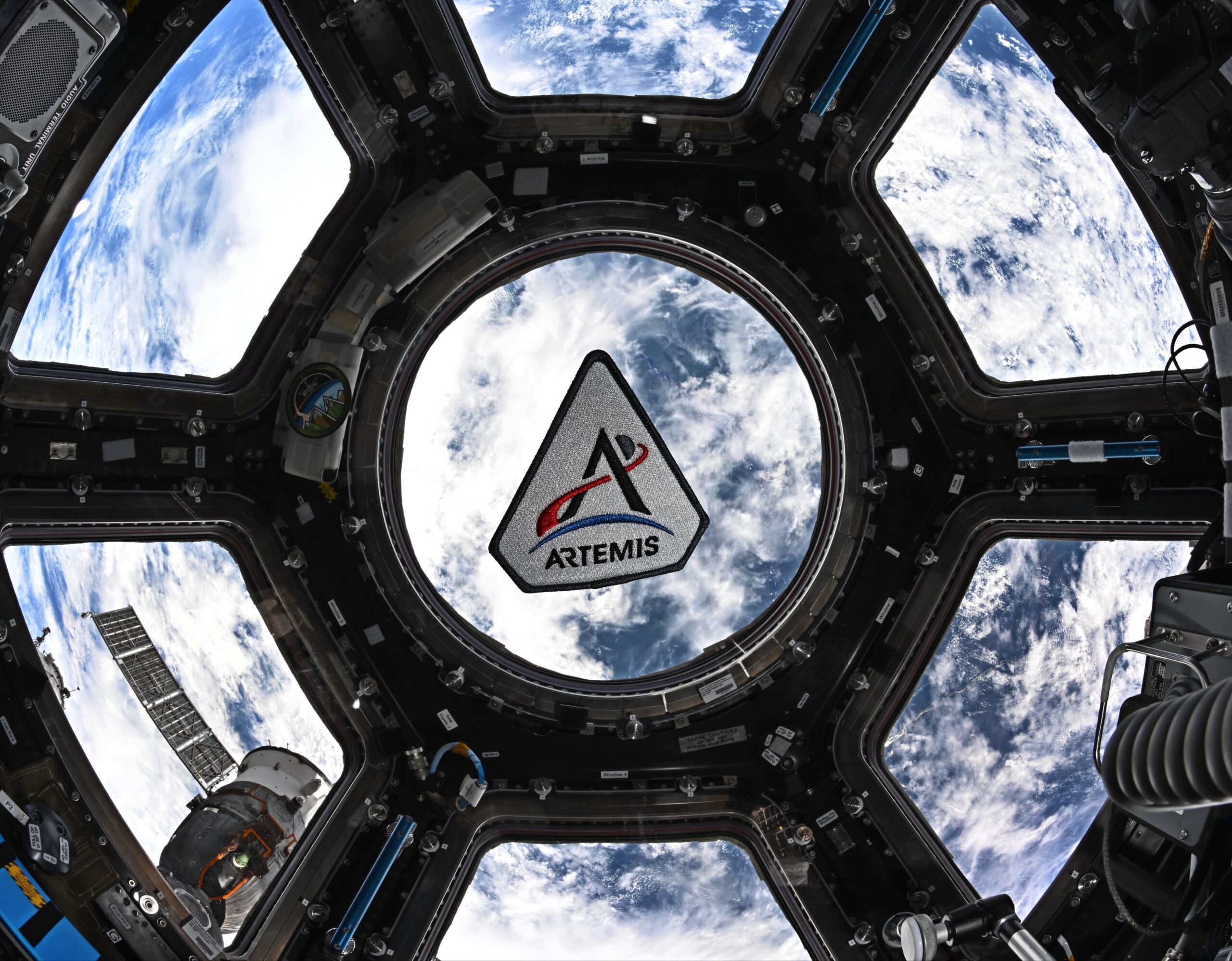 her1pqpbeaazfzl The Artemis program patch in the space station's cupola. The patch is framed by the center circul...