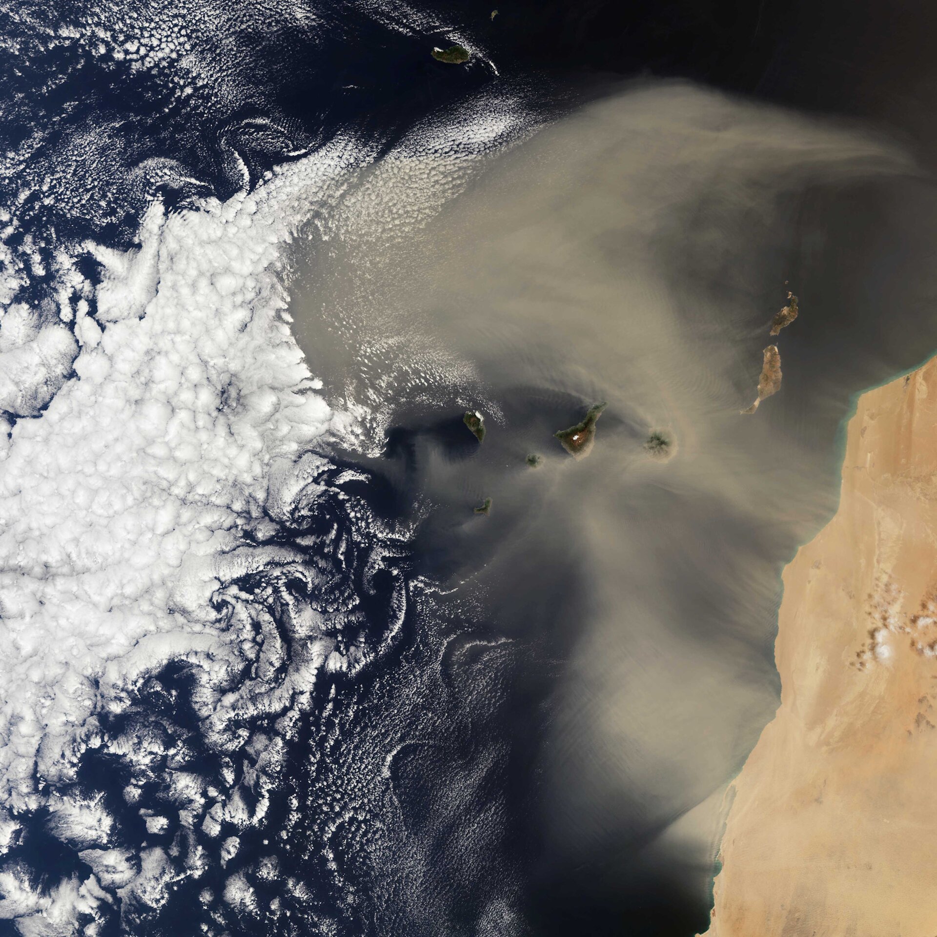 The image from Copernicus Sentinel-3 shows a Saharan dust storm over the Atlantic Ocean, with the...