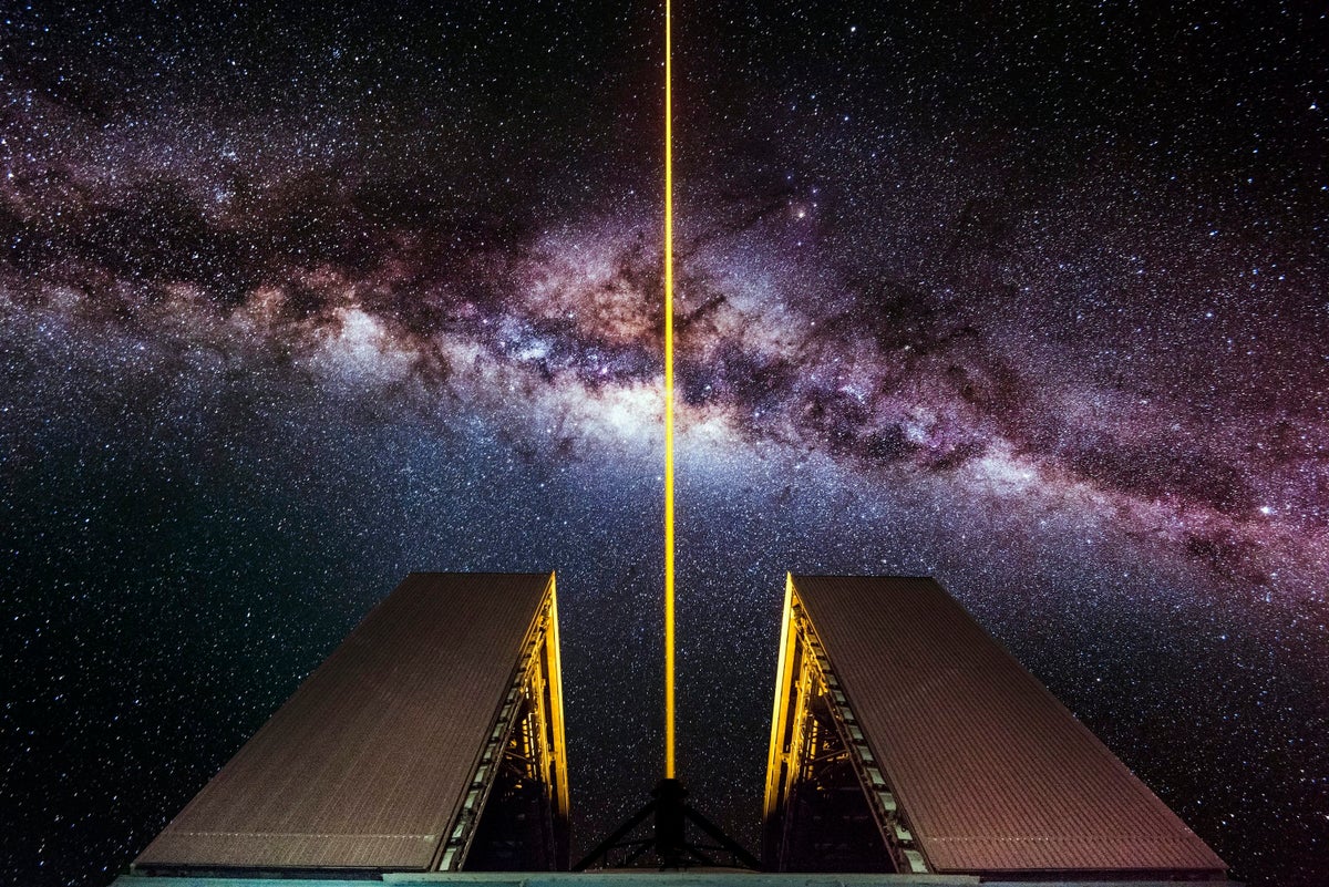 GettyImages-713782741-WEB A laser shoots into the night sky from an 8.2-meter optical telescope at the European Southern Ob...