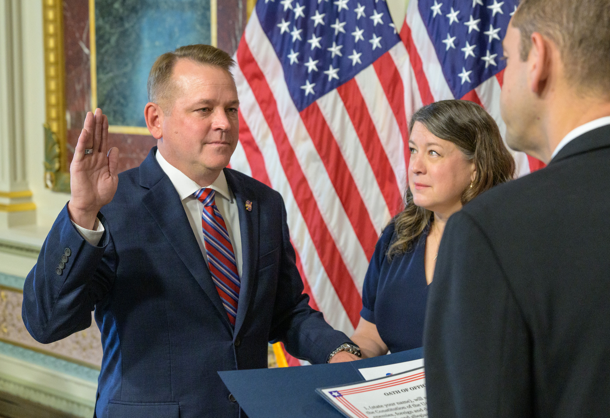 Matt Anderson, left, joined by his wife Christine, is sworn in as the 16th deputy administrator o...