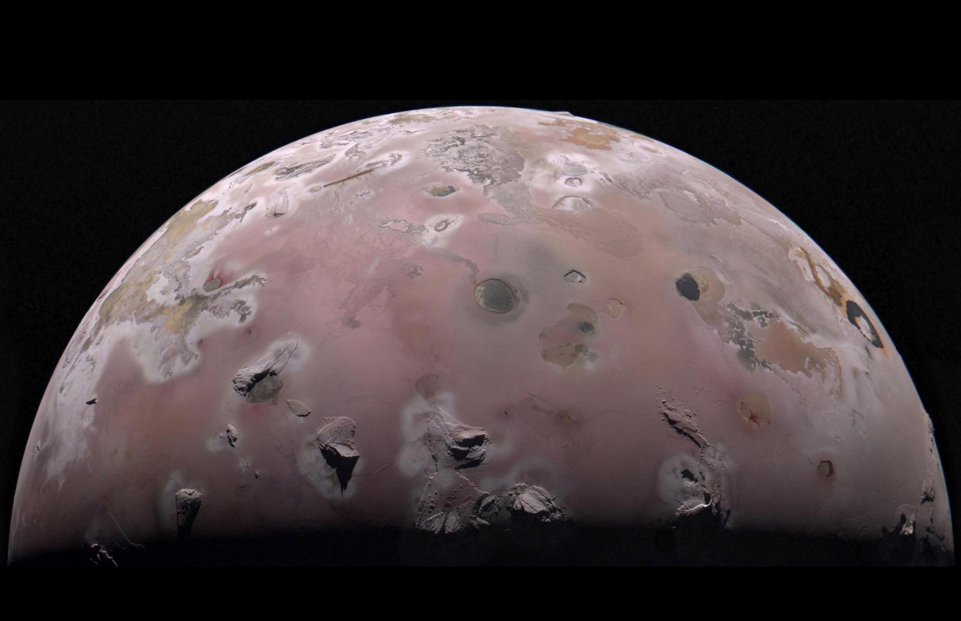 A view of half of the sphere of Jupiter’s volcanic moon Io against black space. The surface is ...