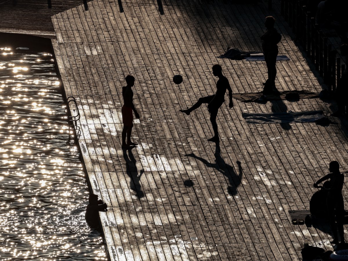 August-heat Visitors to Zakrzówek Lake in Kraków, Poland, cool down in water as a heat wave moves to the na...
