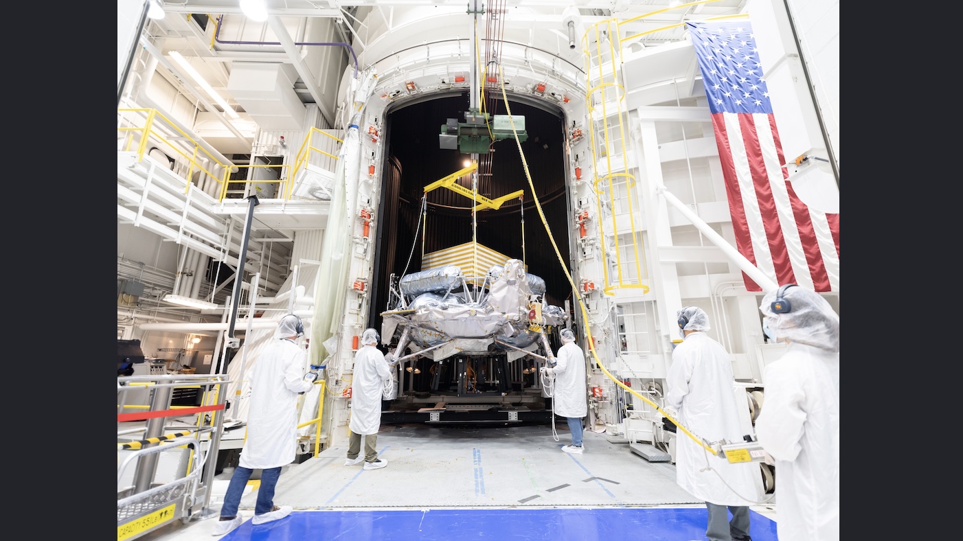 1-pia26708-grifffin-tvac-wings Engineers and technicians use a crane to position Voyager Technologies’ Griffin-1 lunar lander ...