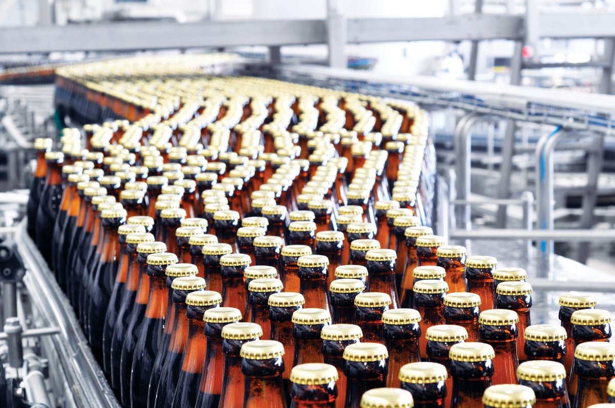 saw1126Adva07 Beer moves down a brewery conveyor belt. industryview/Getty Images