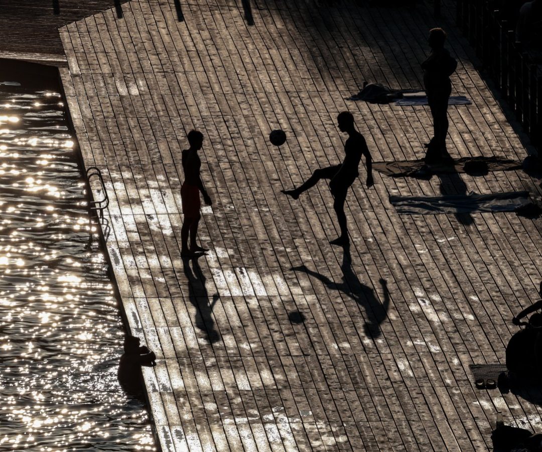 Visitors to Zakrzówek Lake in Kraków, Poland, cool down in water as a heat wave moves to the na...
