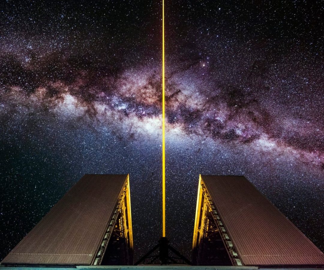 A laser shoots into the night sky from an 8.2-meter optical telescope at the European Southern Ob...