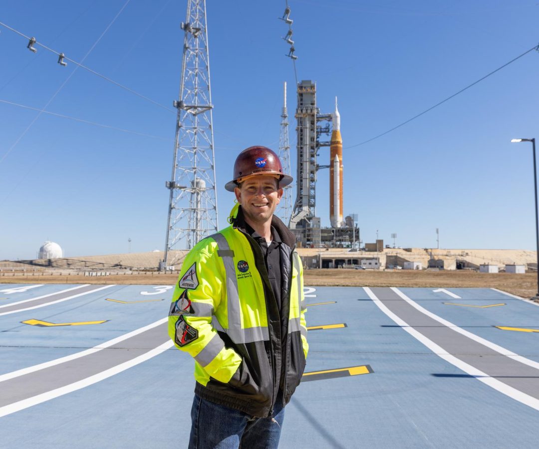 Image shows Jesse Berdis standing standing at the pad of Launch Complex 39B at NASA's Kennedy Spa...