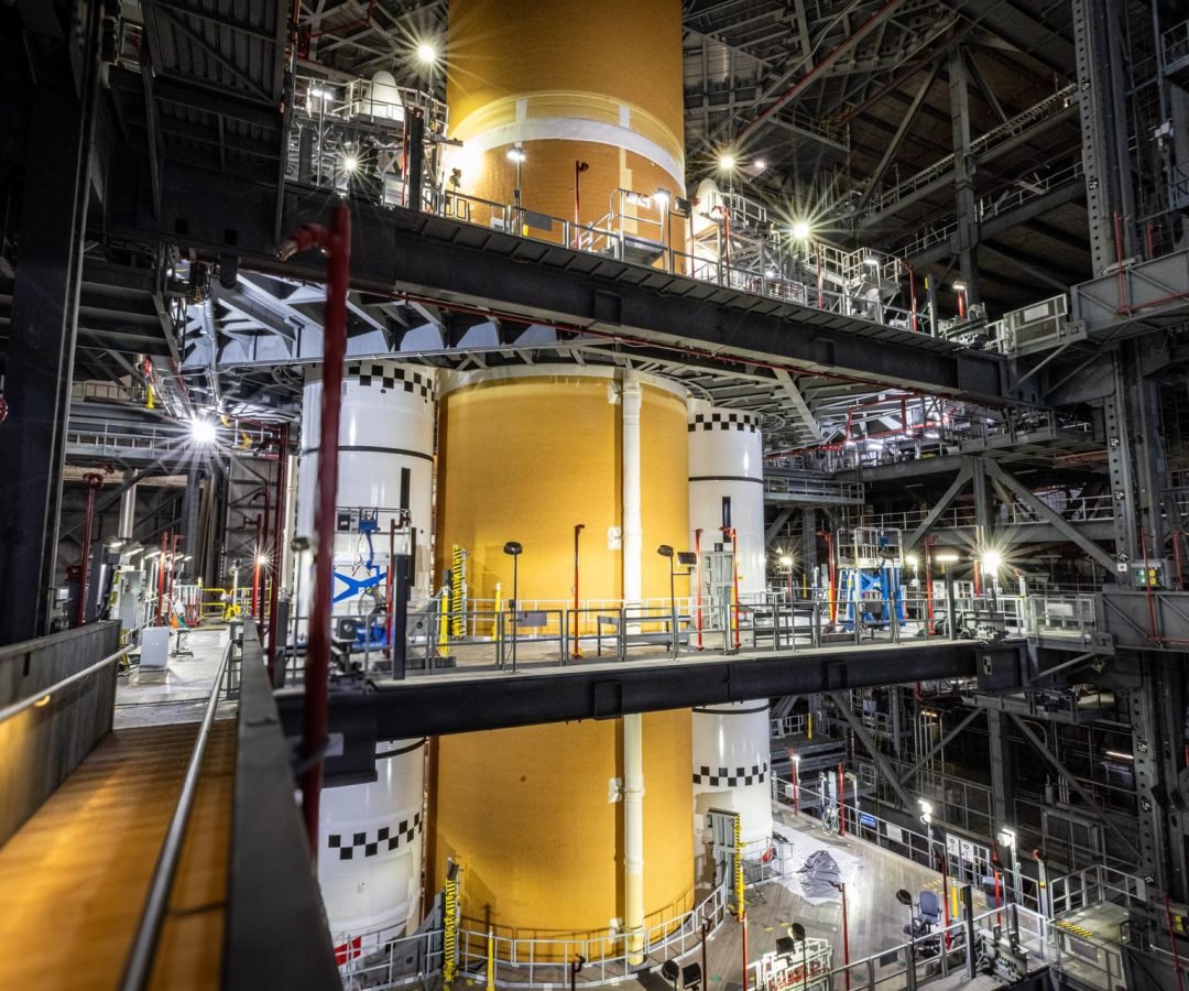 The SLS (Space Launch System) rocket core stage is integrated with the solid rocket boosters for ...