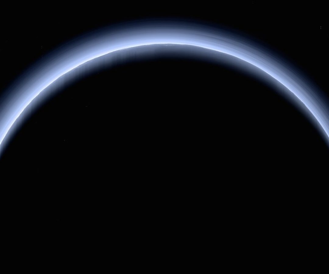 Pluto’s thin, hazy atmosphere shows its blue color in this view from NASA’s New Horizons prob...