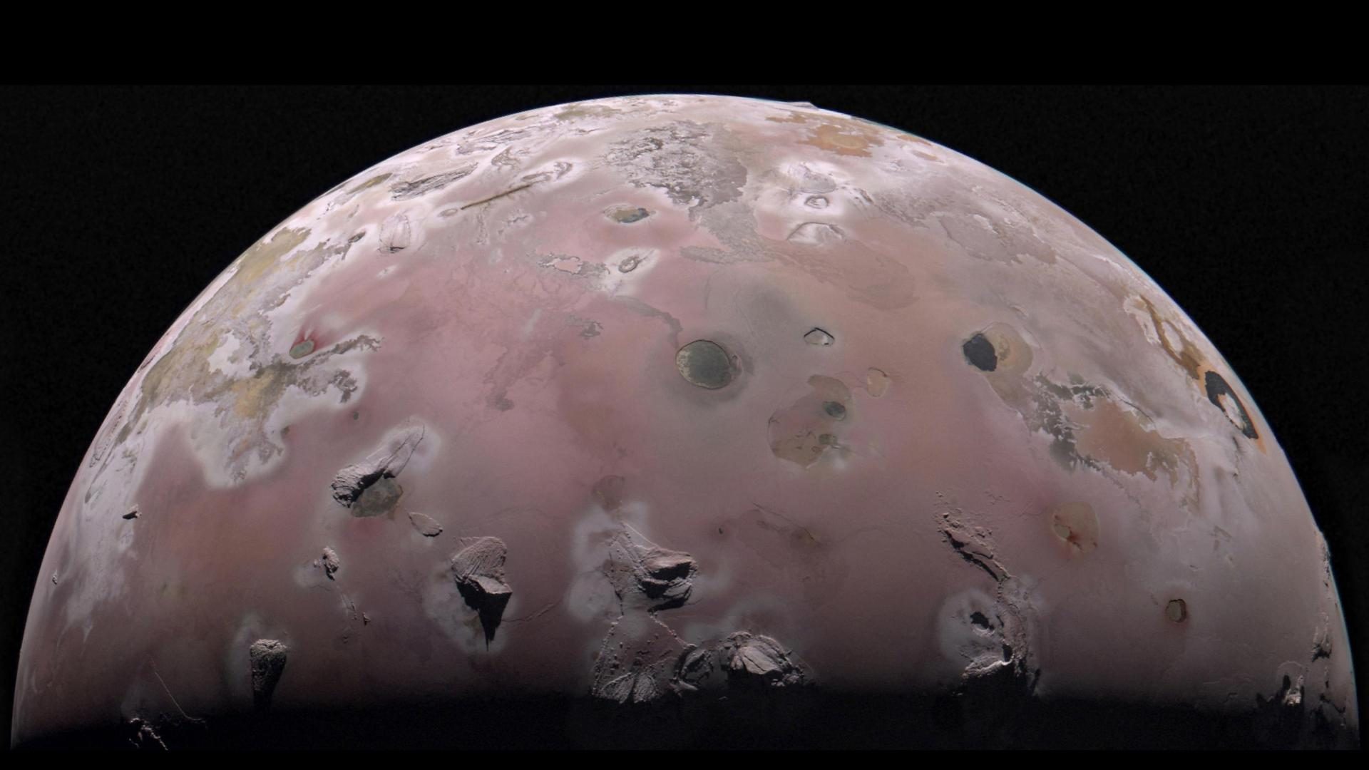 A view of half of the sphere of Jupiter’s volcanic moon Io against black space. The surface is ...