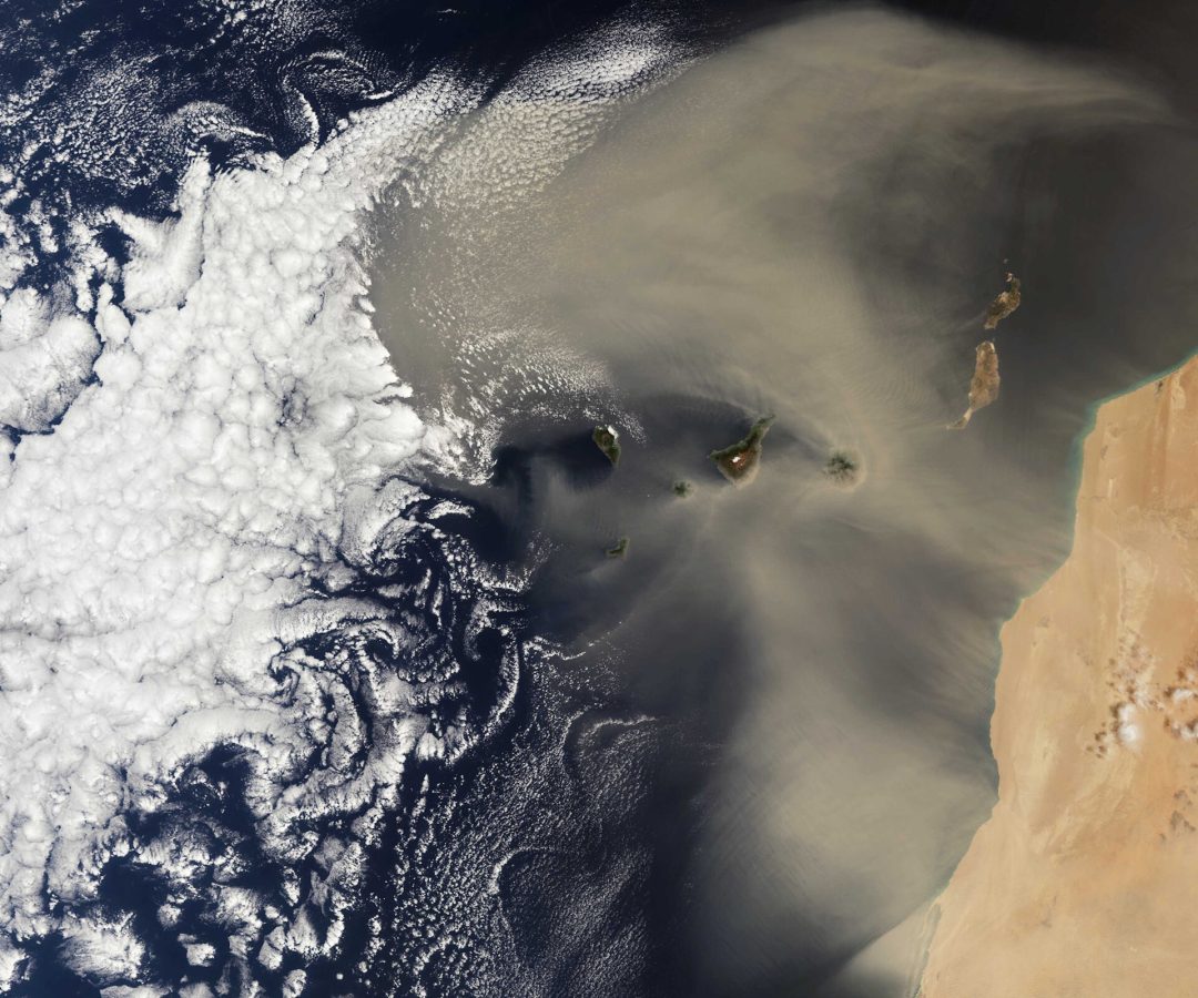 The image from Copernicus Sentinel-3 shows a Saharan dust storm over the Atlantic Ocean, with the...