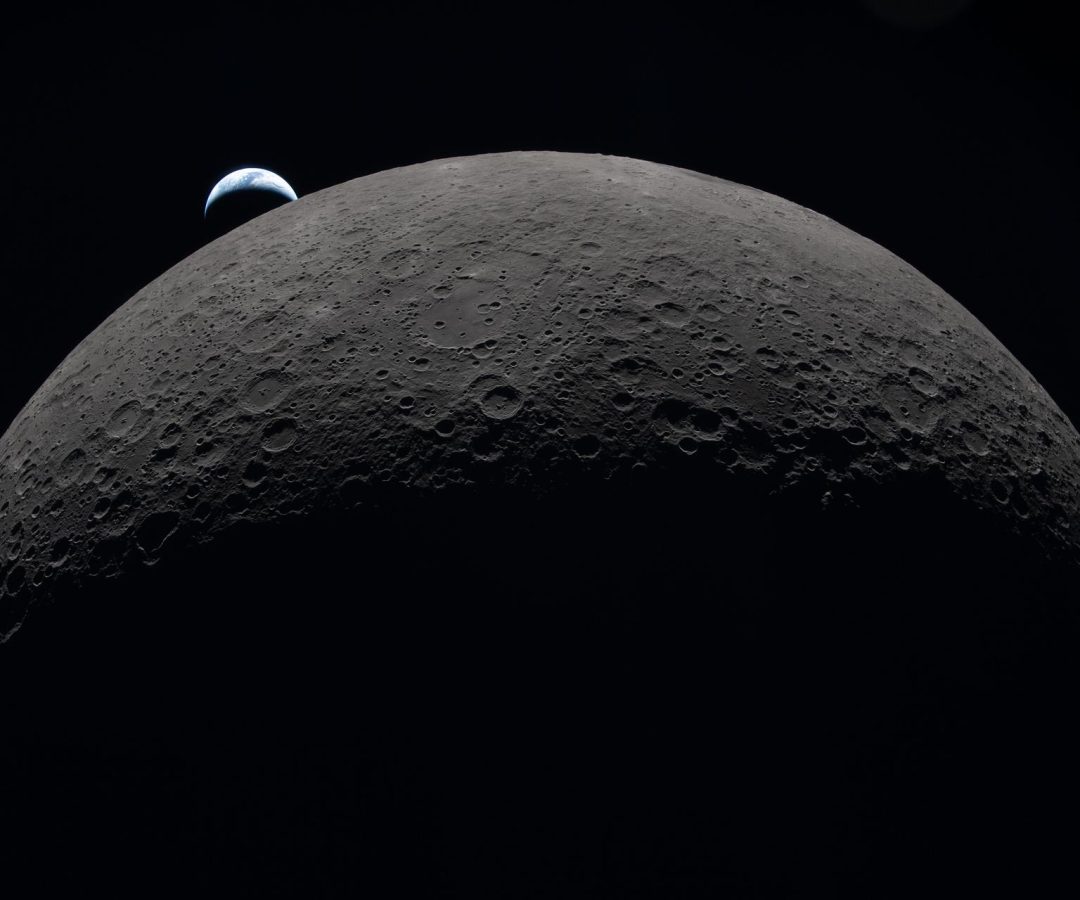 Earth sets at 6:41 p.m. EDT, April 6, 2026, over the Moon’s curved limb in this photo captured ...