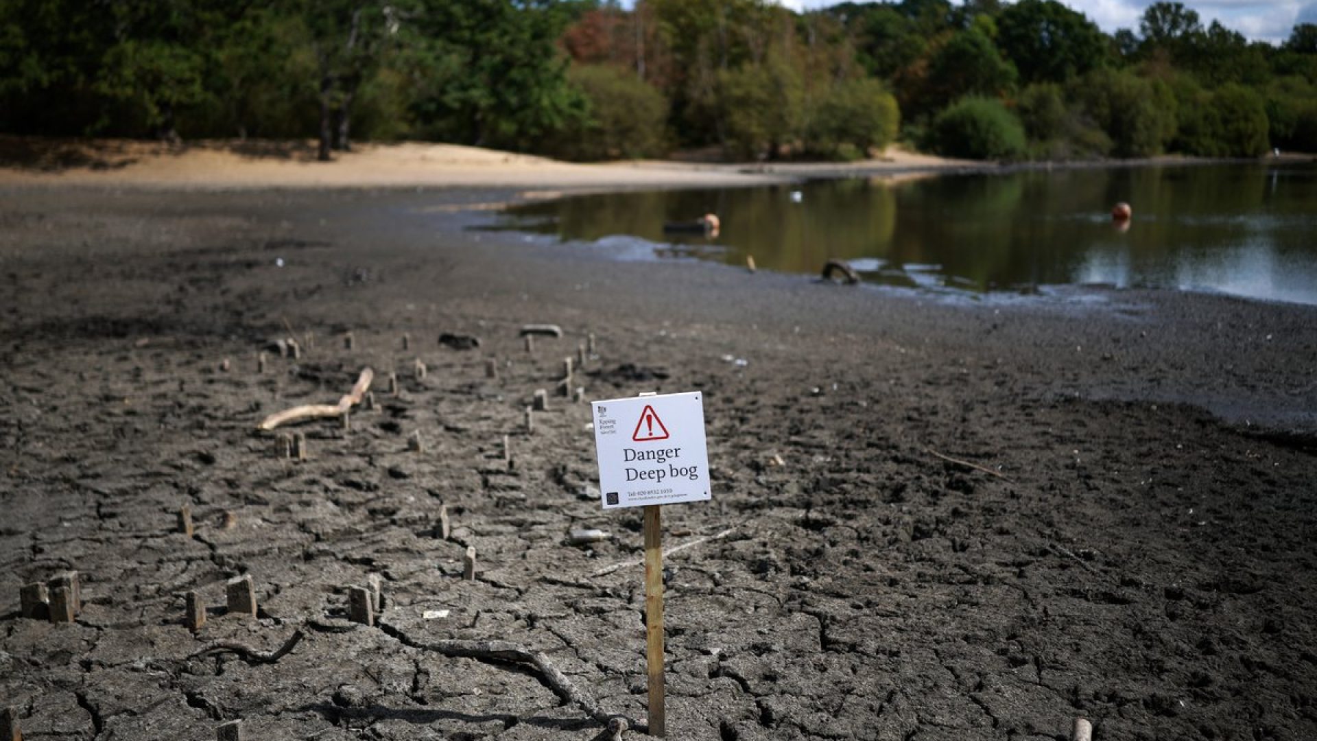 The dried and cracked bed of the depleted Hollow Pond and Leyton Flats near the area of Wanstead ...