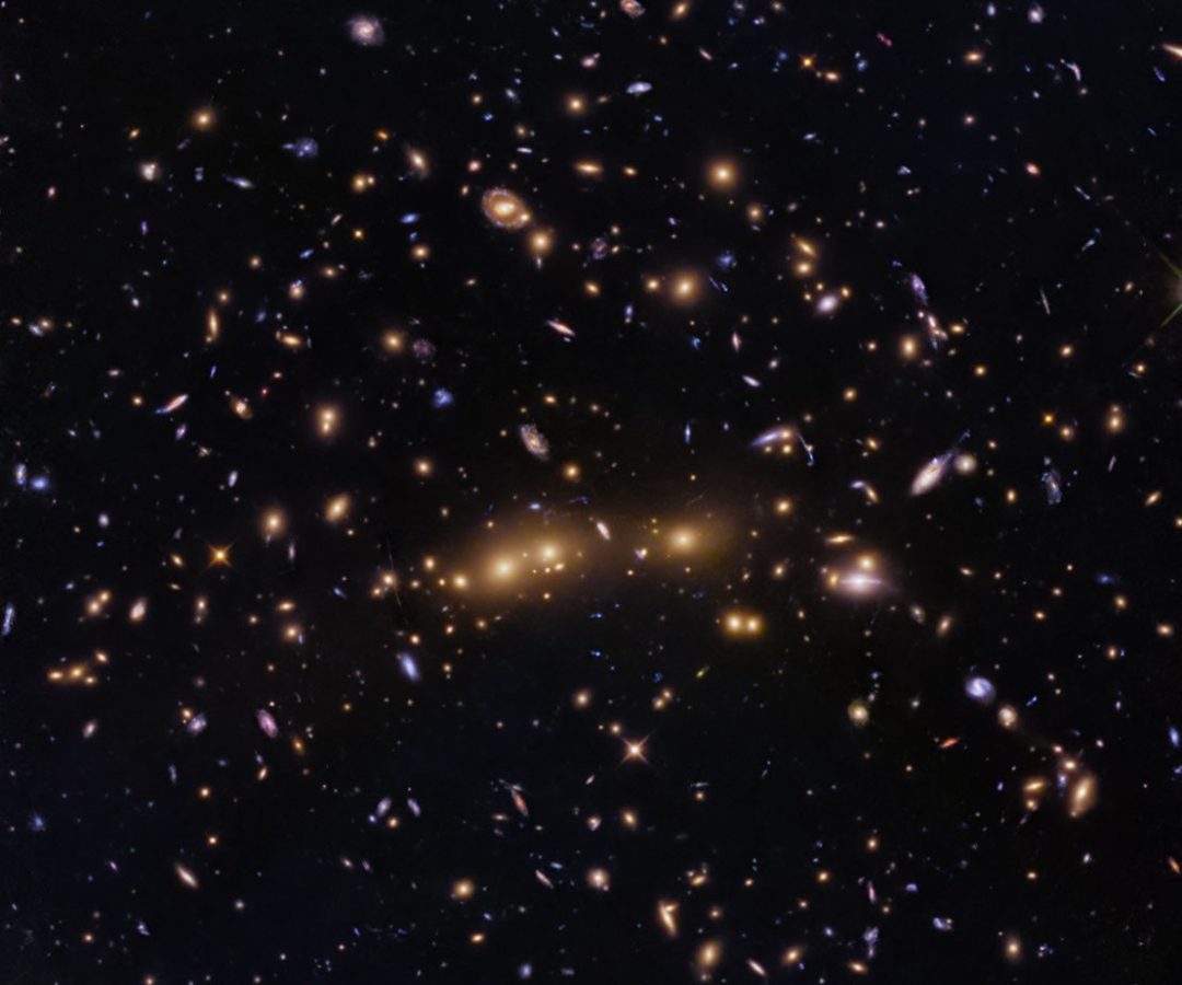 NASA, ESA, H. Ebeling (University of Hawaii), D. Coe (STScI, ESA, JWST); Image Processing: G. Kob...