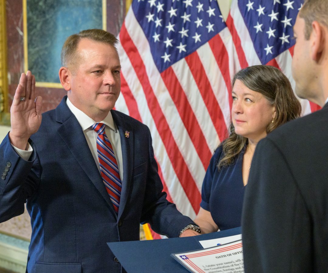 Matt Anderson, left, joined by his wife Christine, is sworn in as the 16th deputy administrator o...