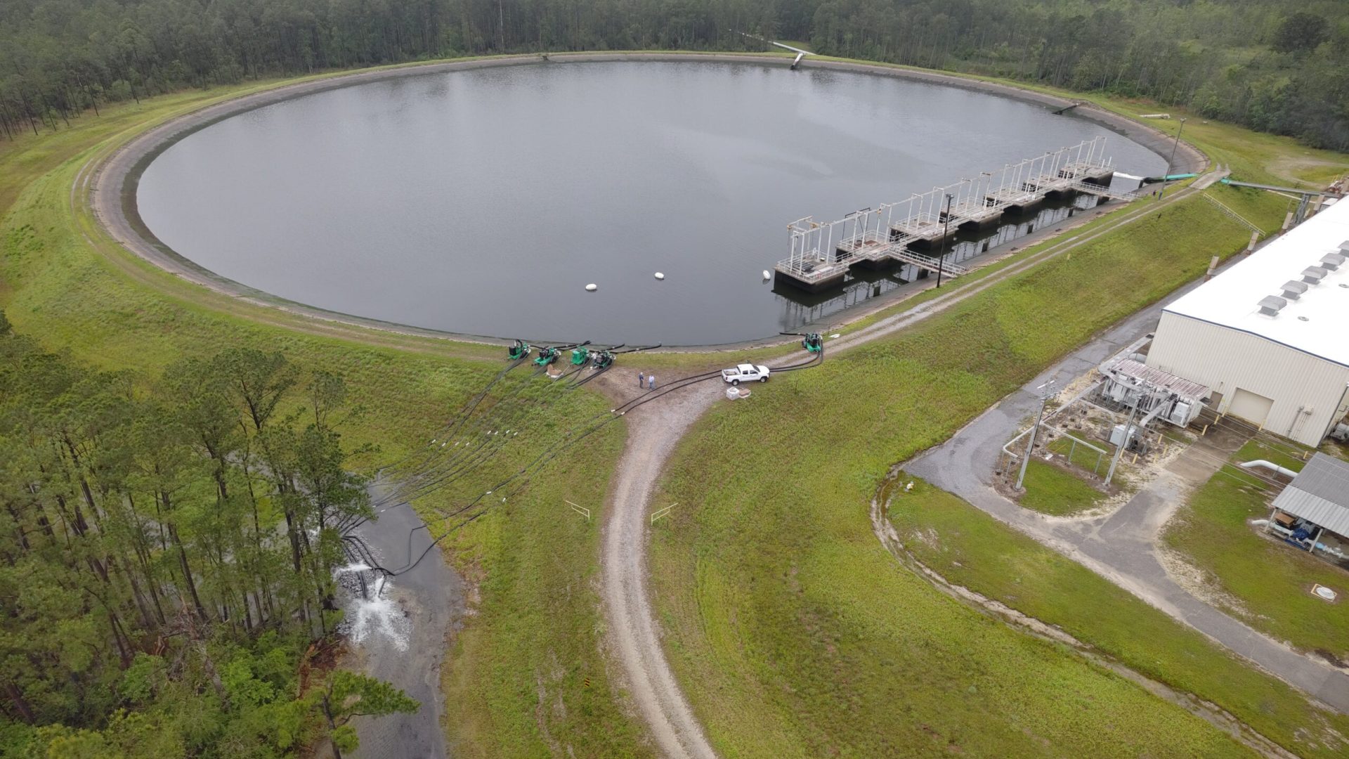 A drone image shows the High Pressure Industrial Water Facility’s 66-million-gallon reservoir a...