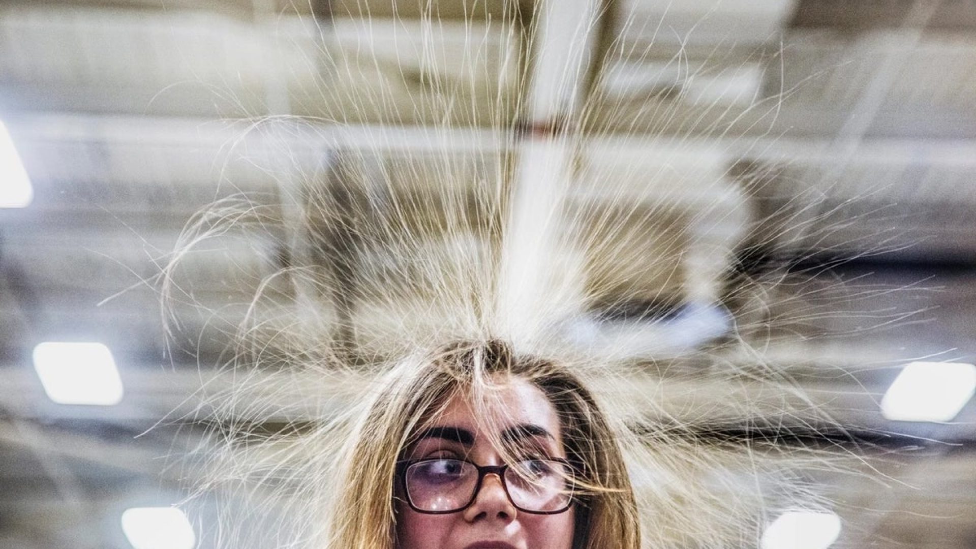 When hair picks up an electrostatic charge, the strands repel each other and stand on end. Whitne...